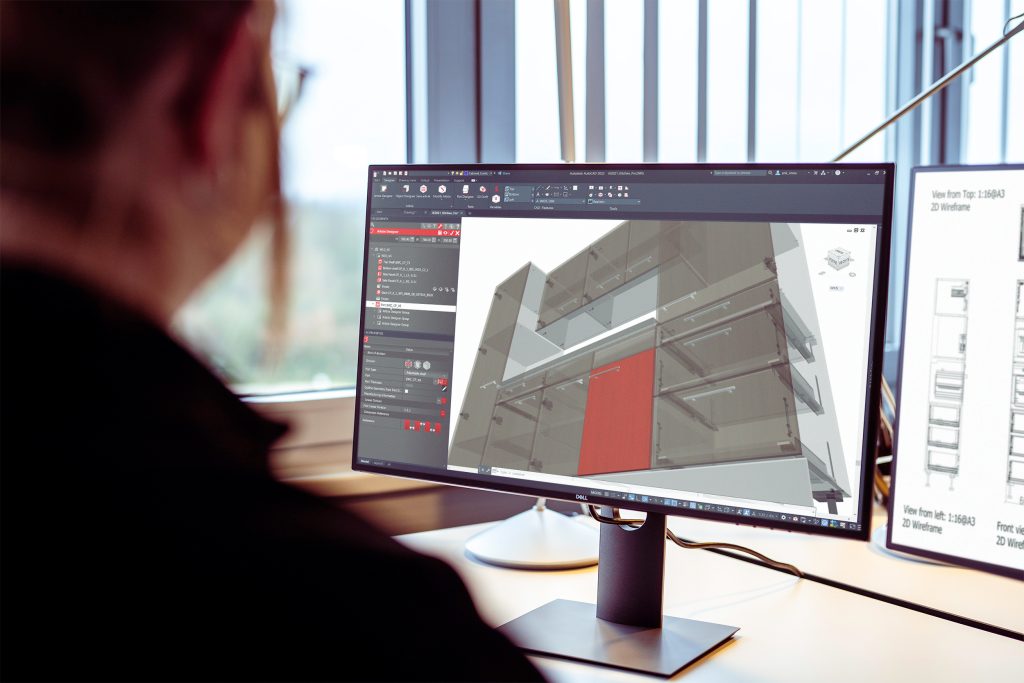 Man sat at computer looking iX CAD software